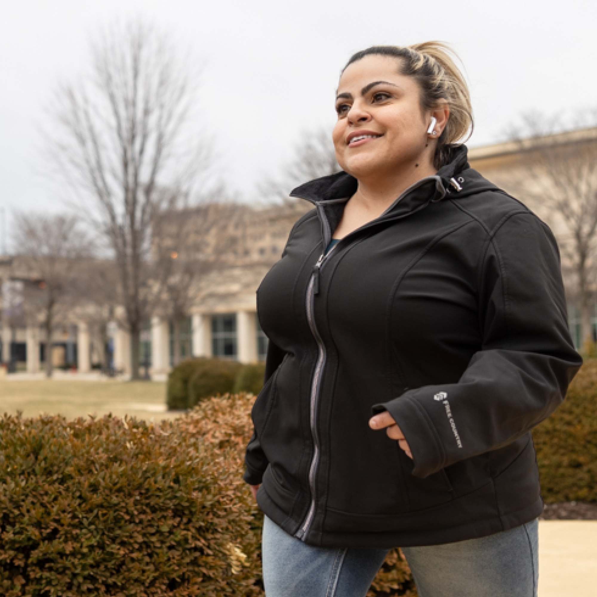 Young woman with a disability walking in park