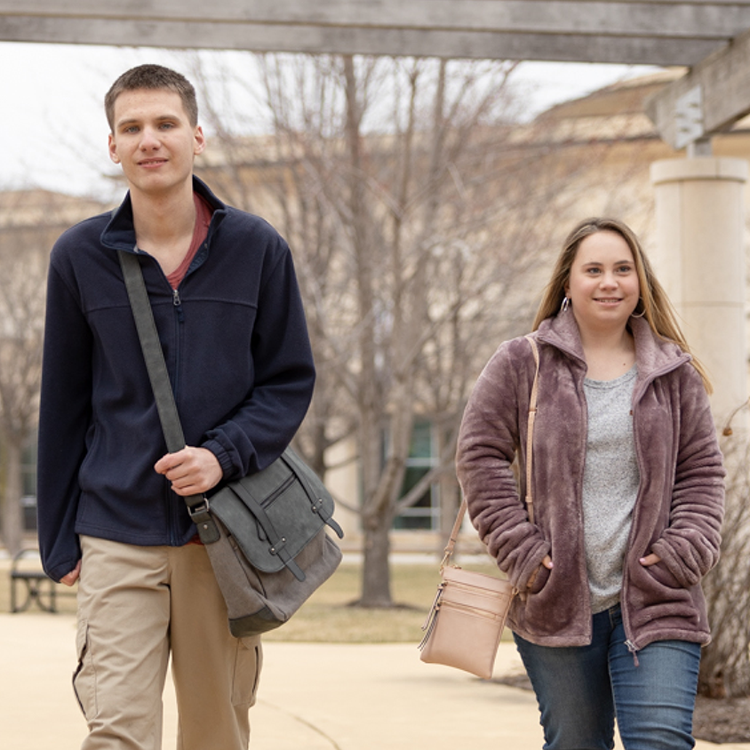 Young adults with disabilities walking on campus